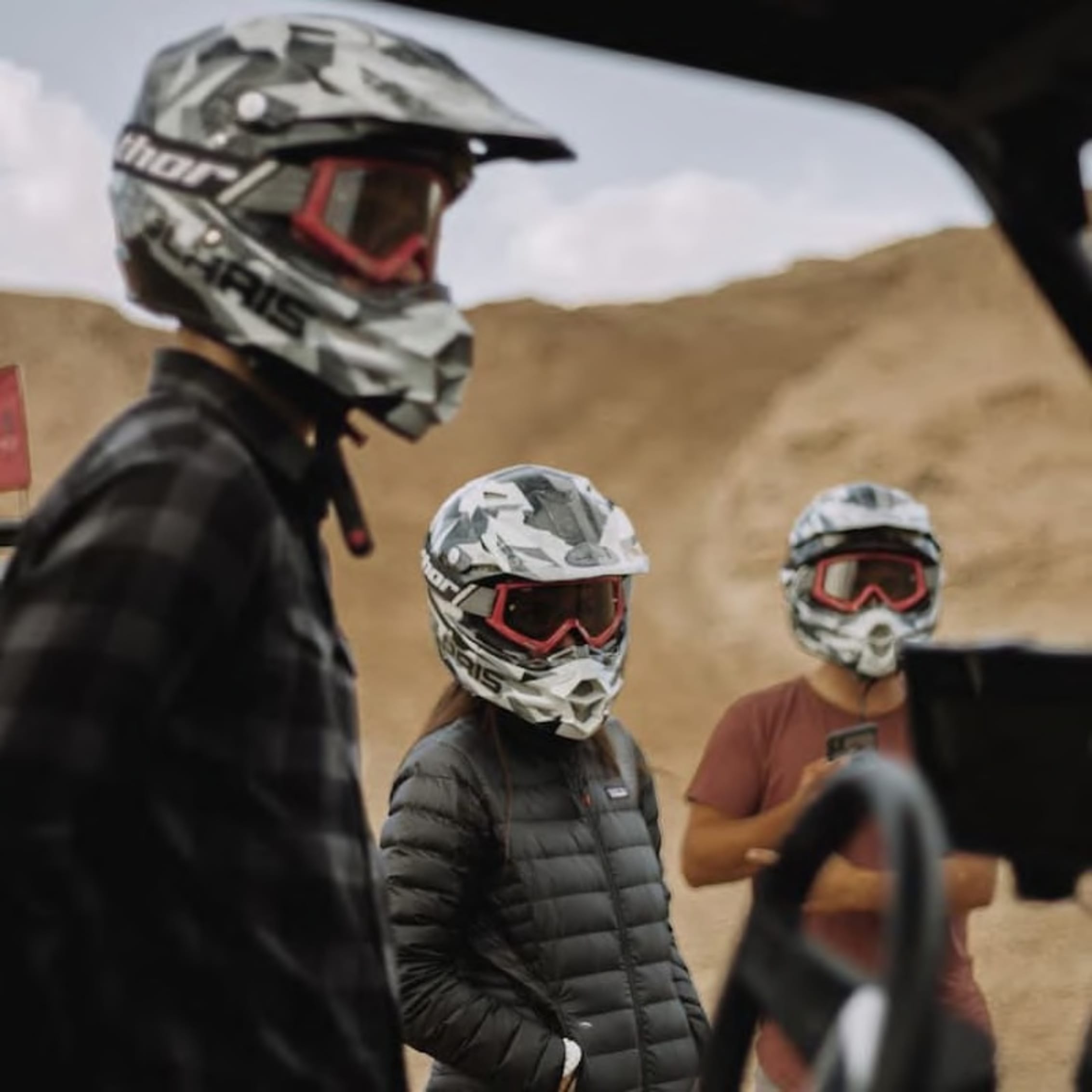 Adventurers in helmets discussing with a guide, highlighting safety and service.