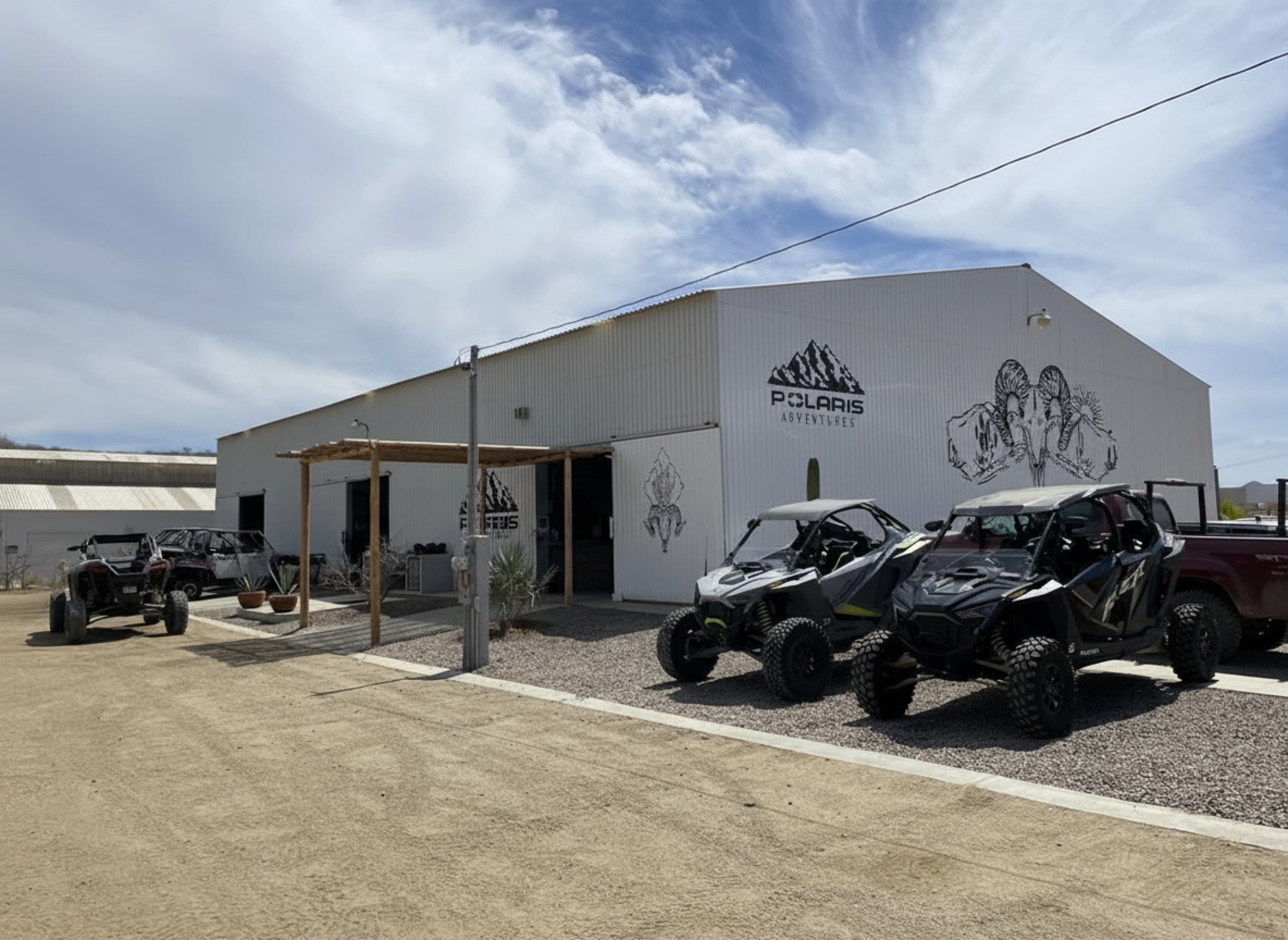 Two Polaris RZR vehicles on display outside of Rock Pirate Adventures showcasing national brand credibility.