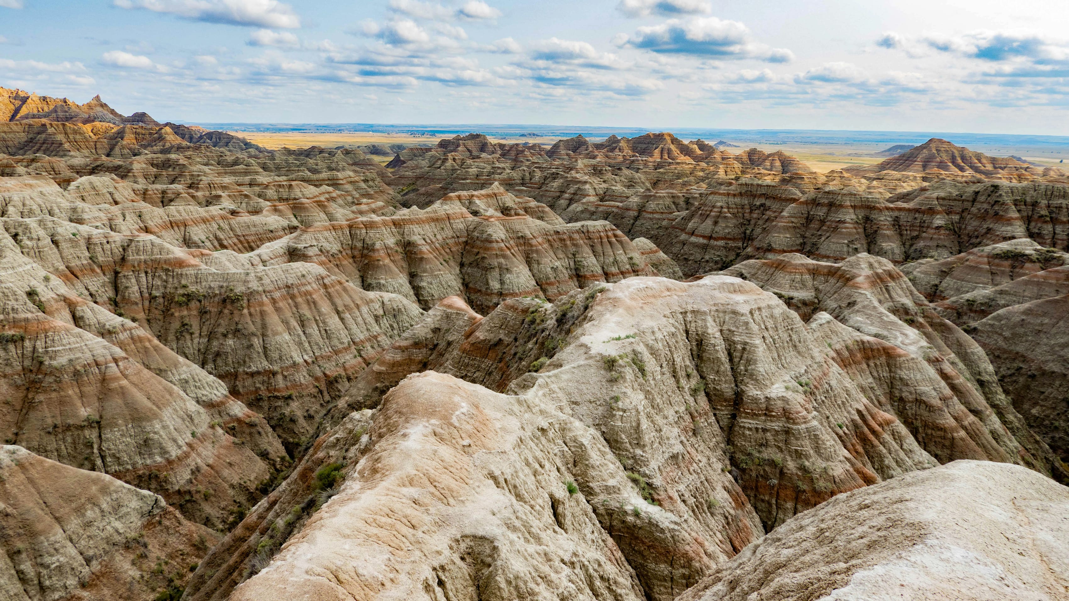 Scenic view of the layered rock formations and vast skies at the Badlands National Park