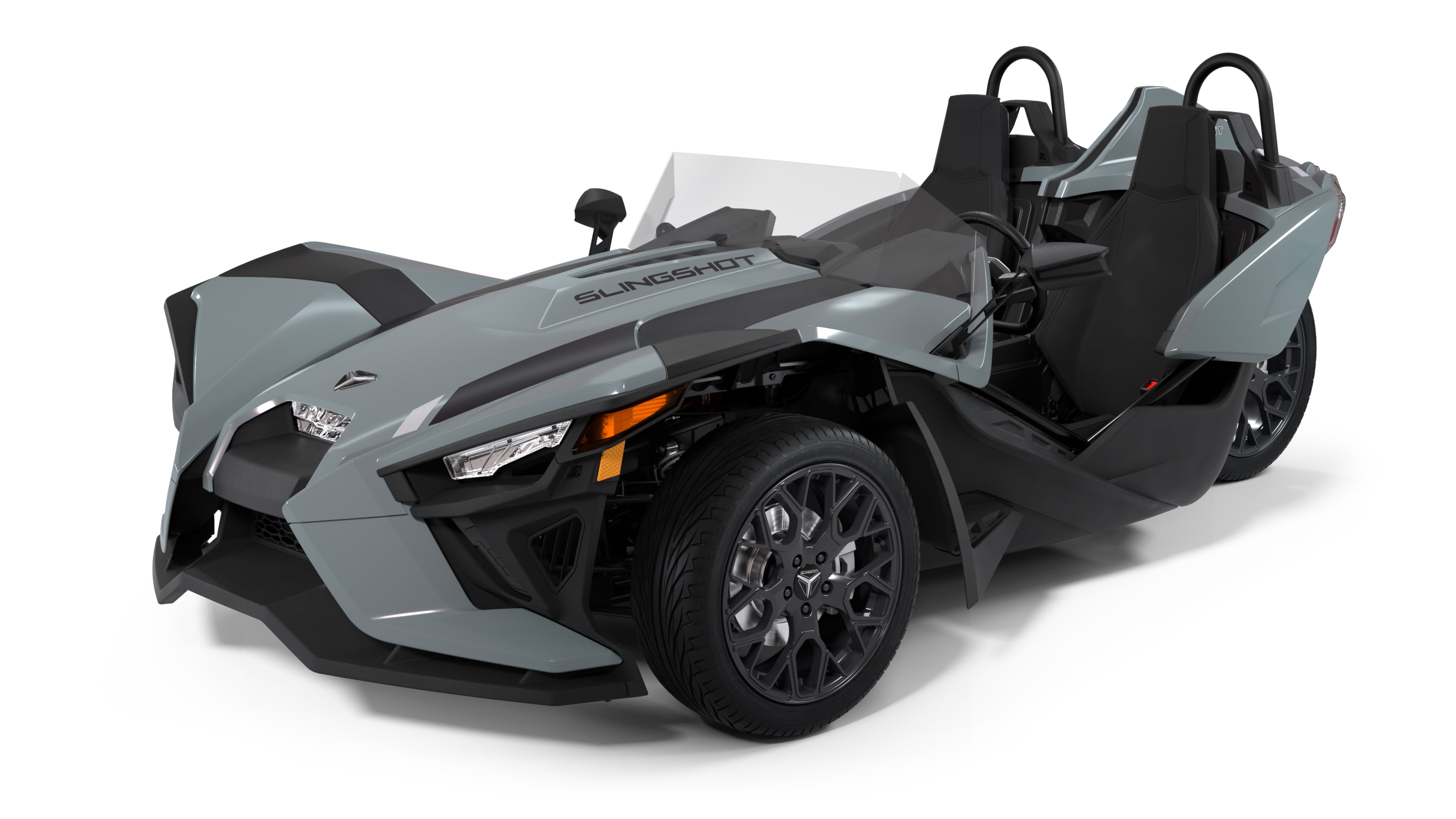 A front view of a red Polaris Slingshot SL, highlighting its unique three-wheeled design with two seats and an open cockpit.