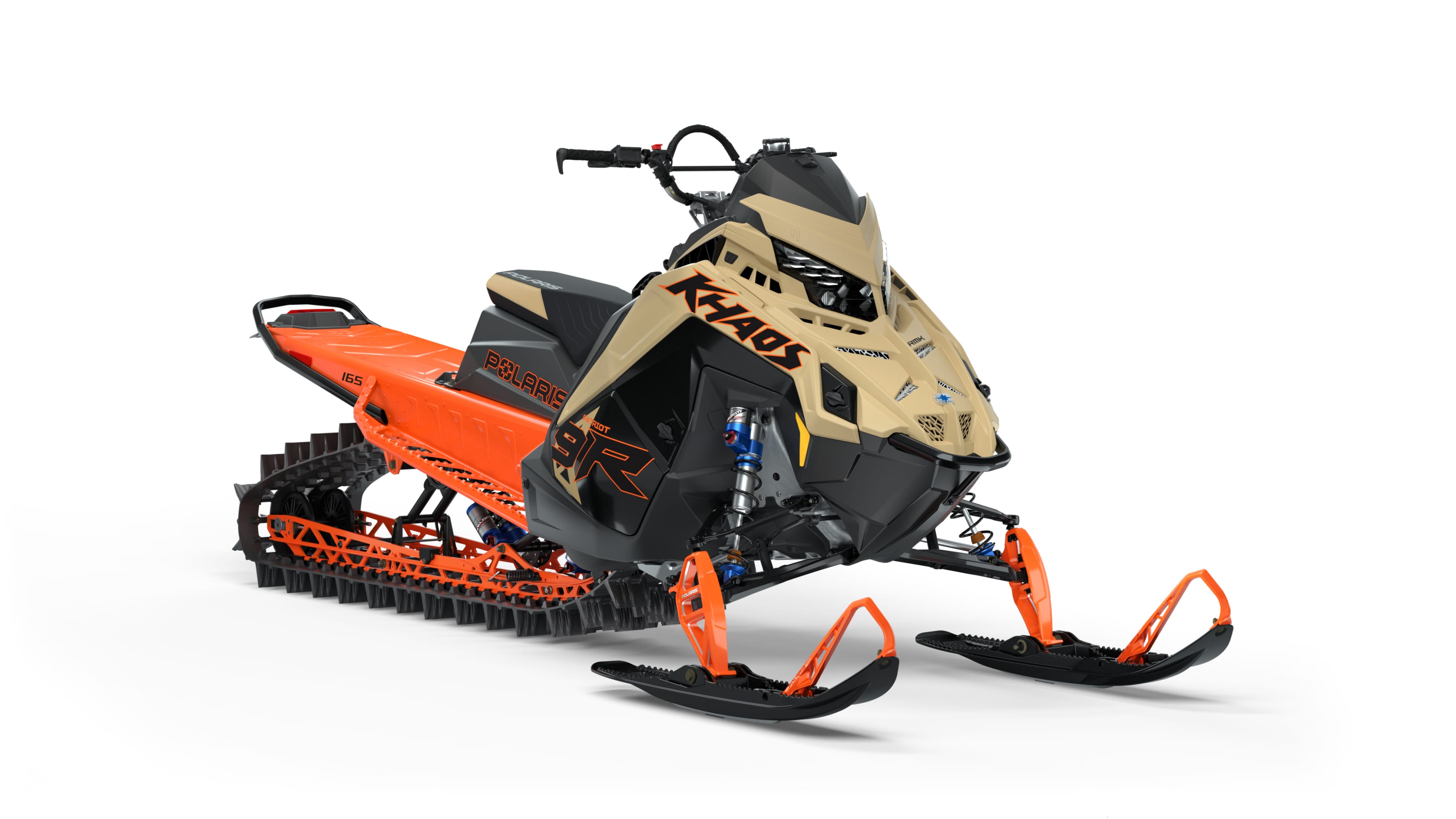 New Polaris RMK snowmobile in orange and beige showcasing its sleek design and durable tracks on a white background.