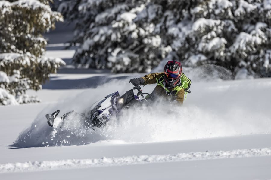 Polaris Snowmobile and helmet parked on the Big Flat along Paiute Trail