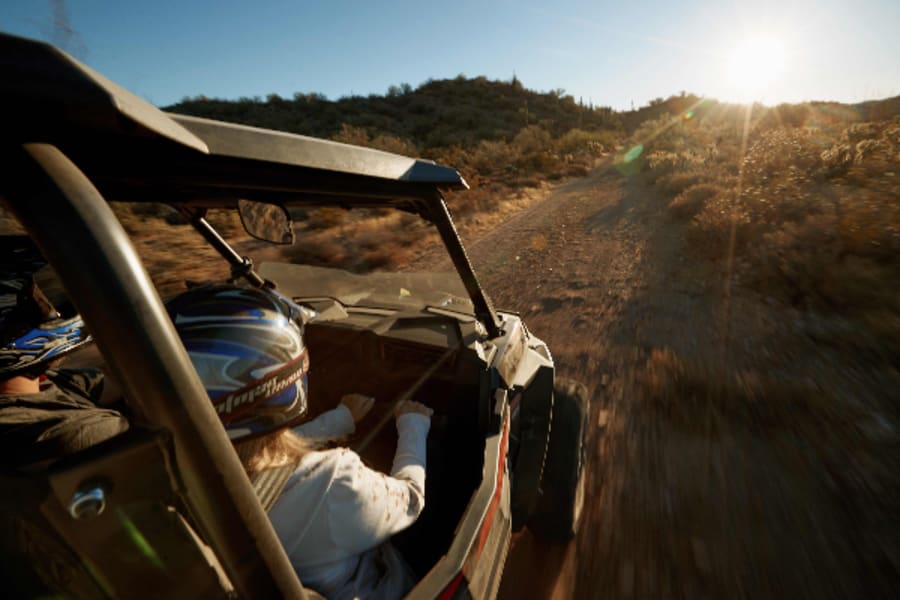 Two people in Polaris ORV