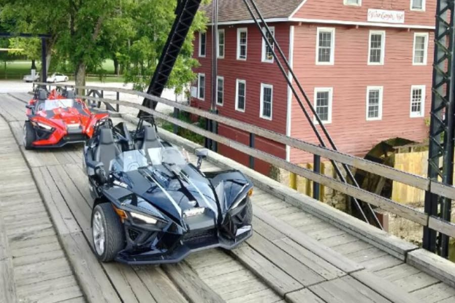 Polaris Slingshots on a bridge