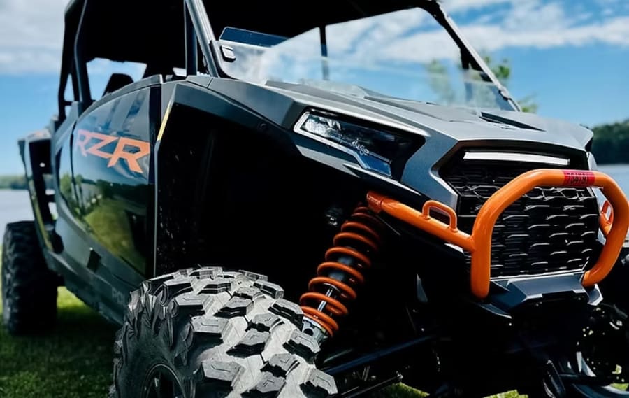 Four people in Polaris RZR
