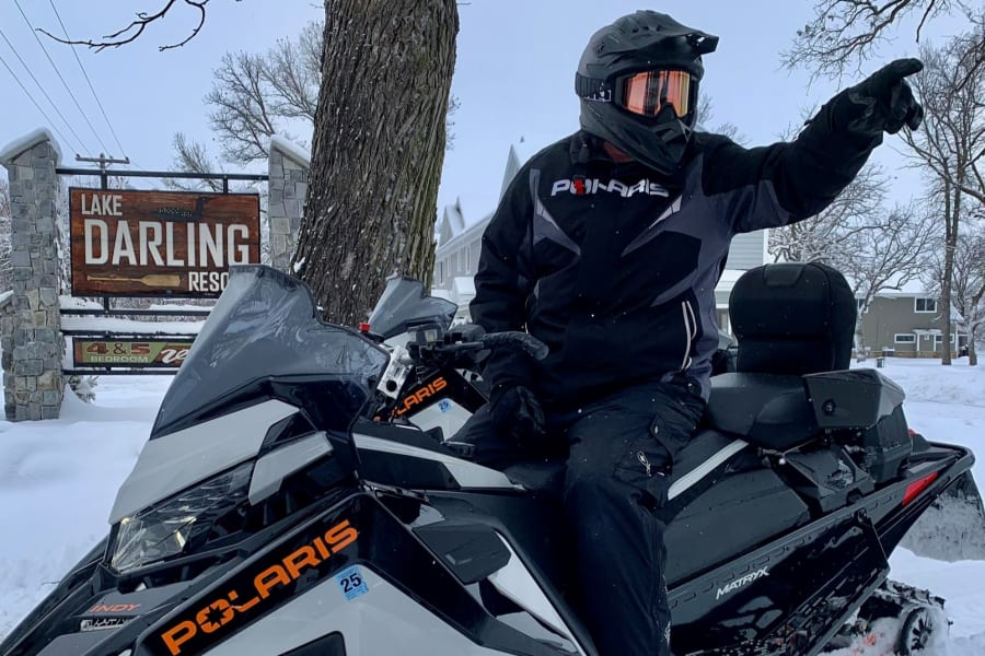 Snowmobiler on Polaris snowmobile at Lake Darling Resort