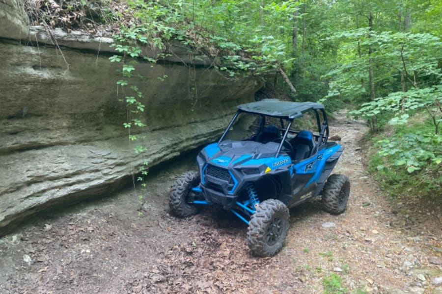 Blue Polaris RZR by rocky overhang
