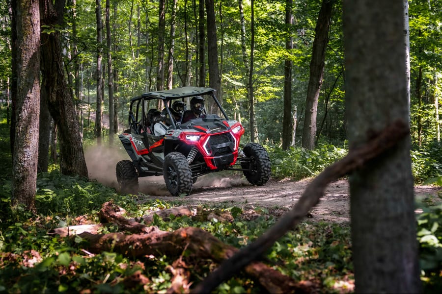 Red Polaris RZR in Upper Peninsula woods