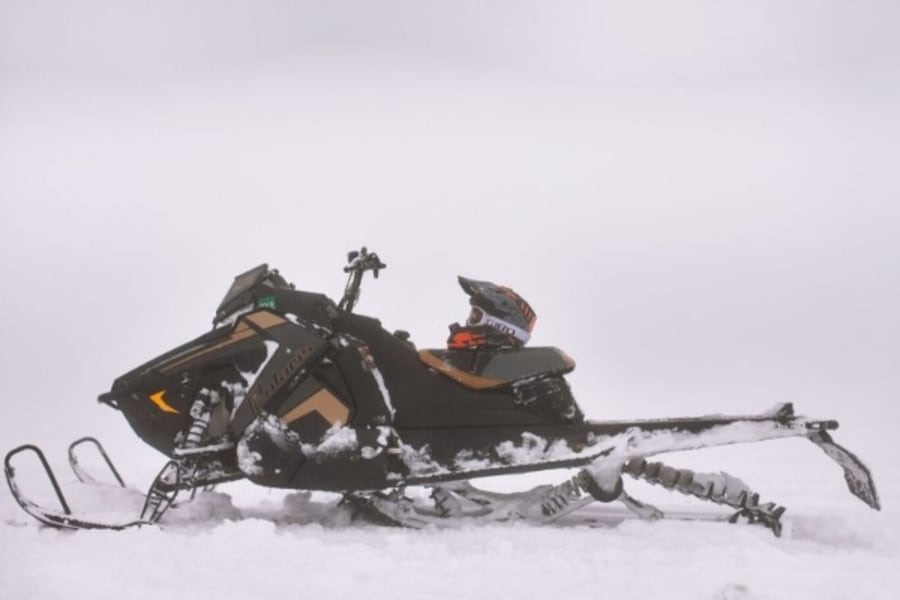 Snowmobile helmet on Polaris snowmobile seat