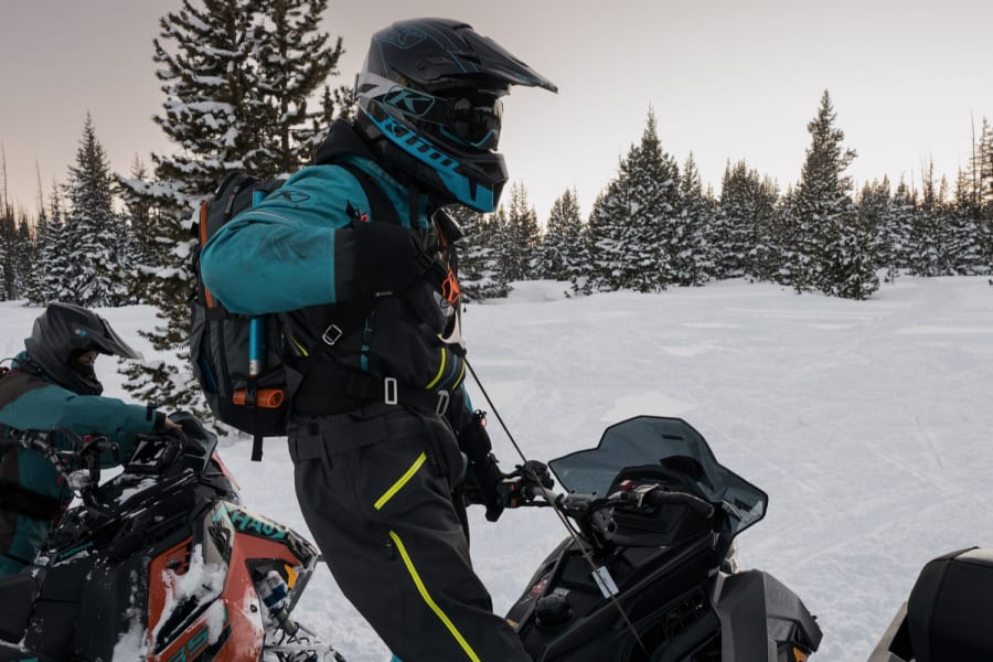 Rider on Polaris snowmobile, standing