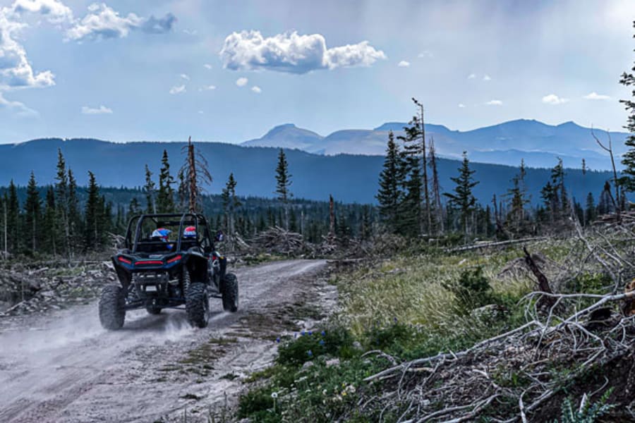 Polaris side by side driving on gravel trail in Colorado