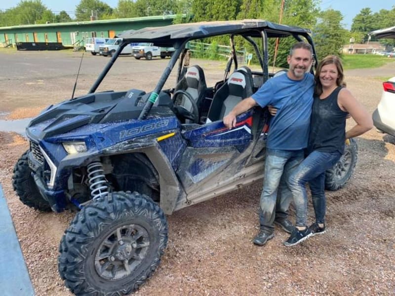 Kelley Earnhardt Miller and Hubby back from a few laps in a RZR