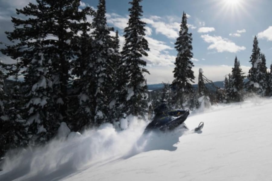 Snowmobile in fresh powder