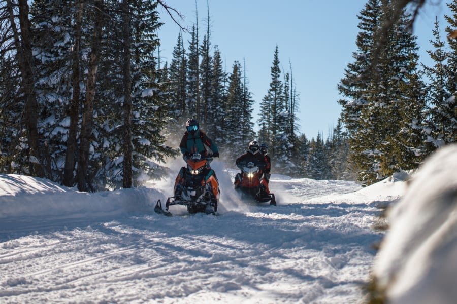 Two Polaris snowmobile riders in Wyoming