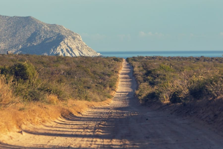 Off-road trail with ocean in the distance