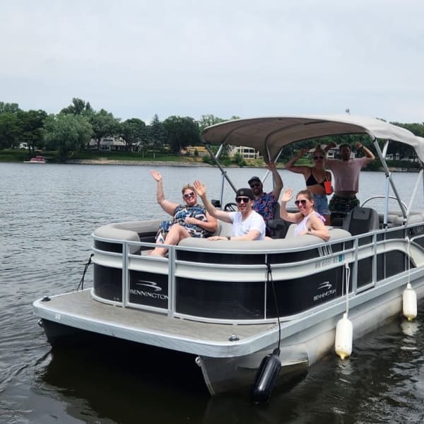 Group of friends on pontoon in Minnesota