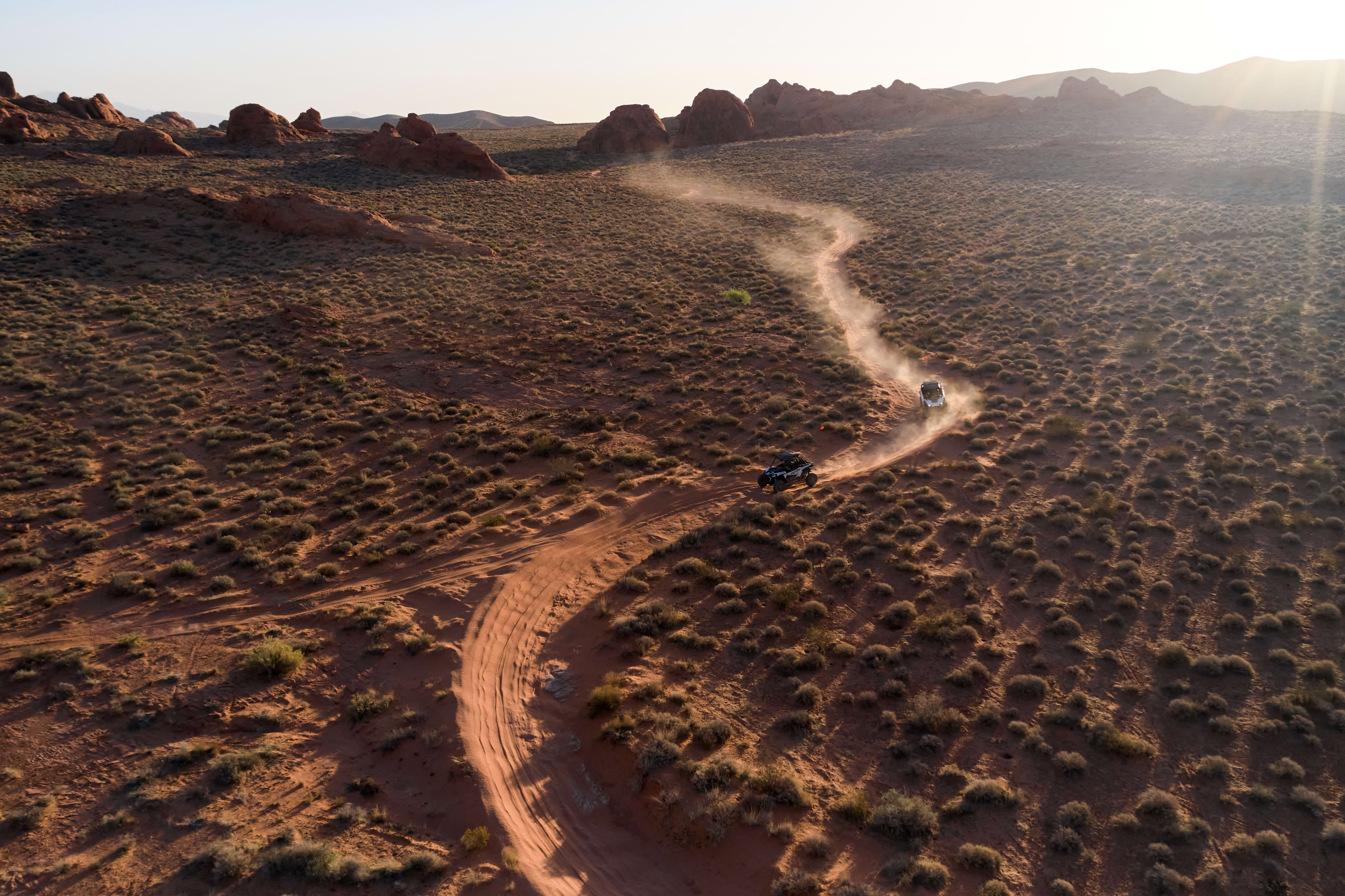 Two Polaris SUVs in Vegas desert