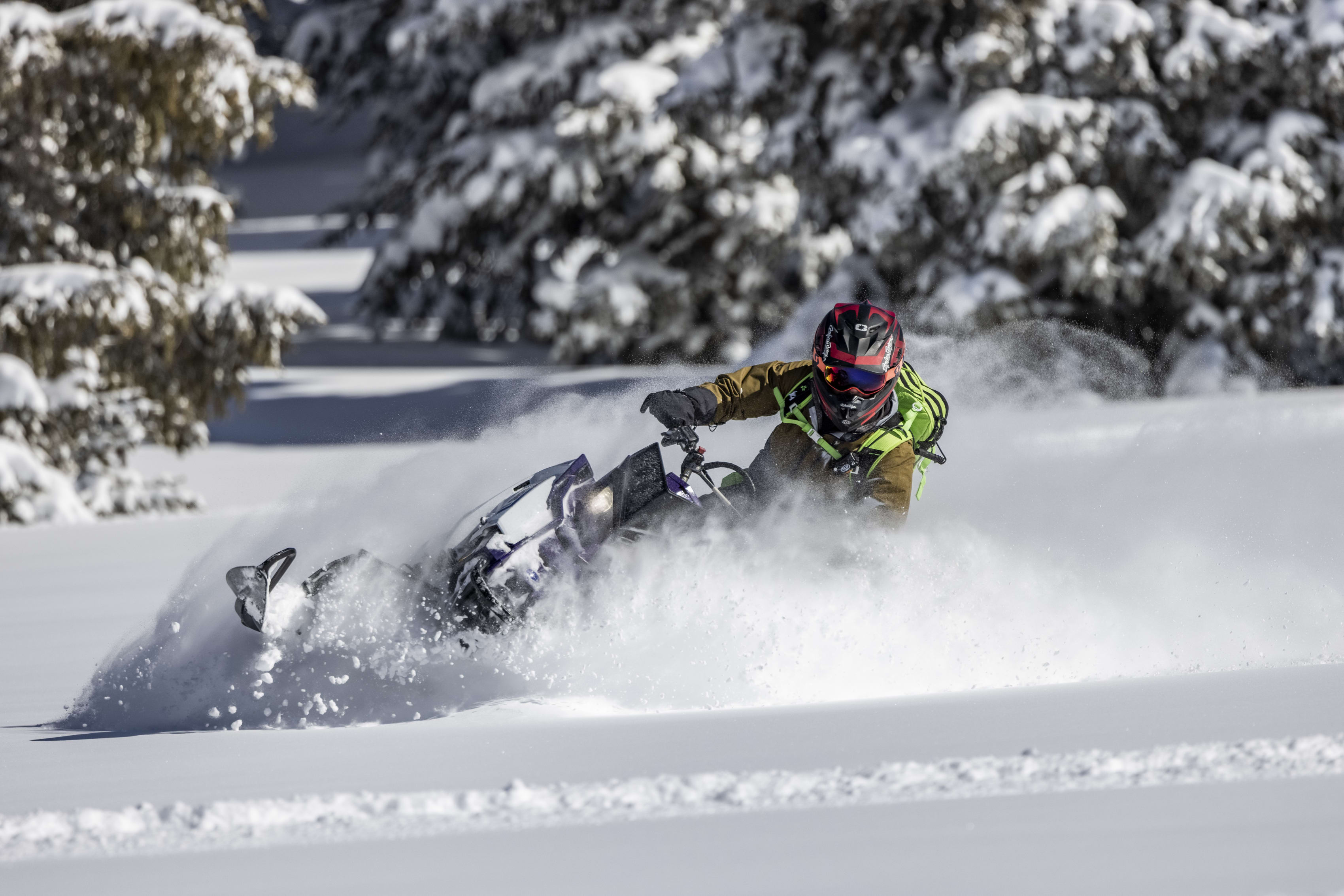 Polaris Snowmobile and helmet parked on the Big Flat along Paiute Trail