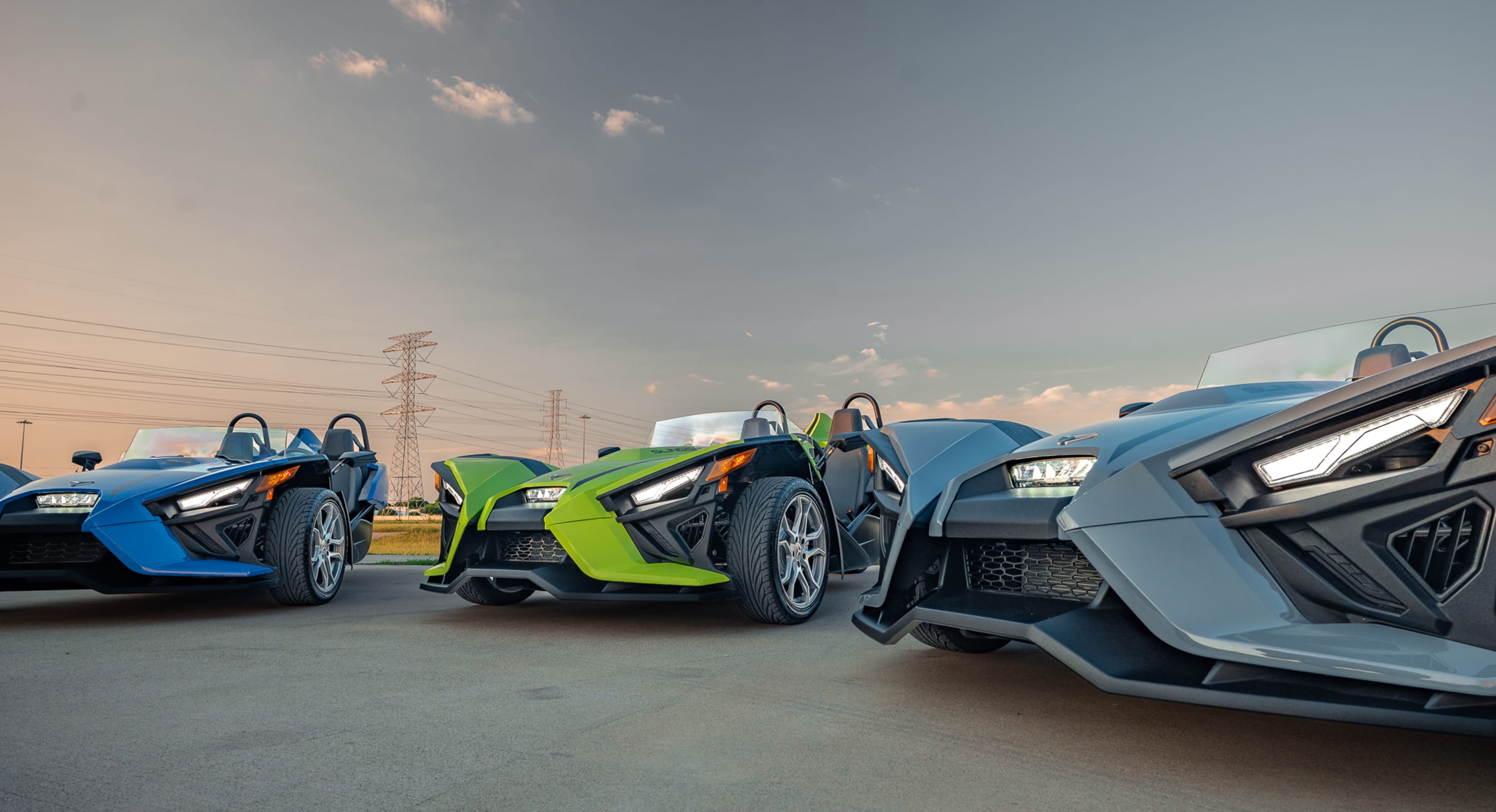 Three Polaris Slingshots at dusk in Houston