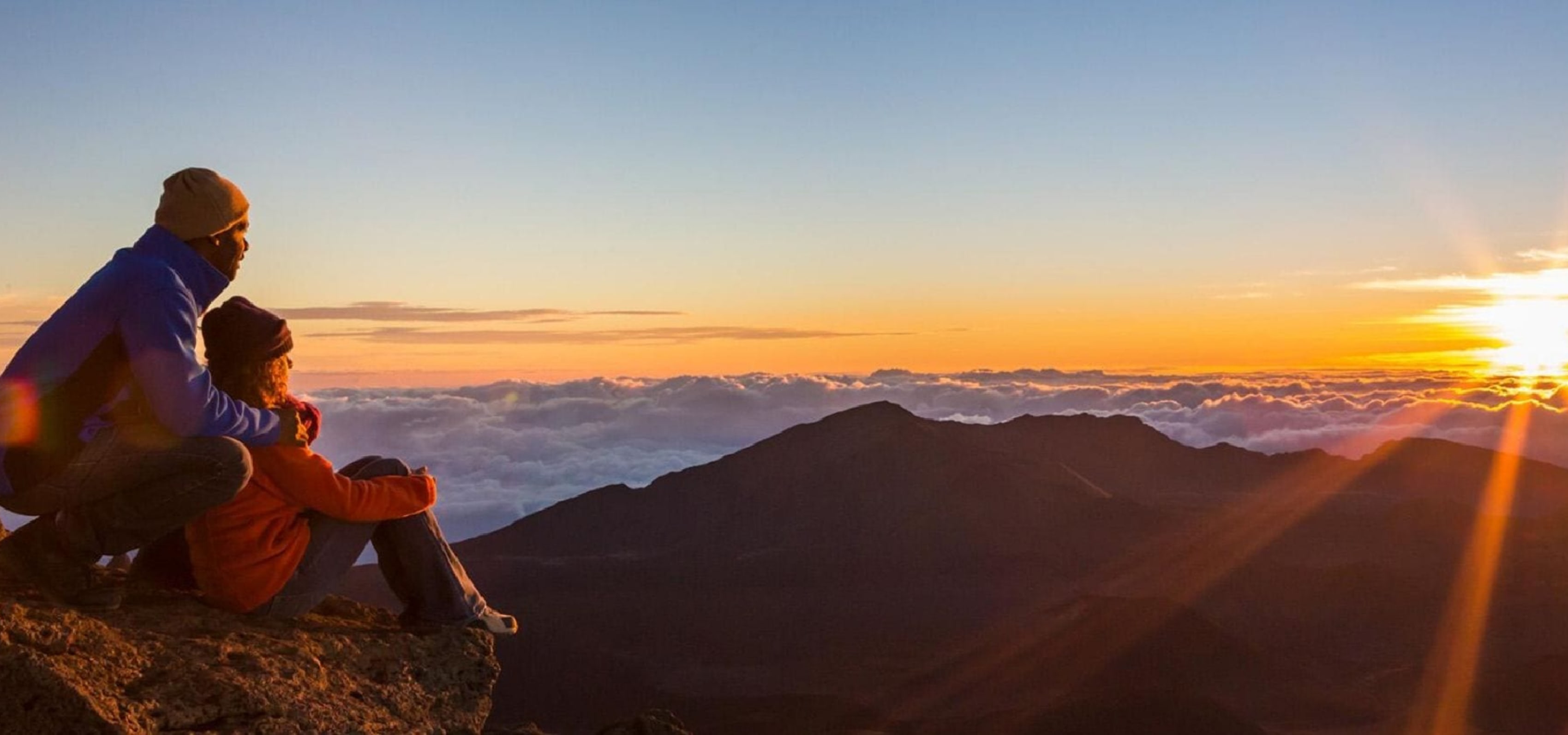 Couple looking at Maui sunset