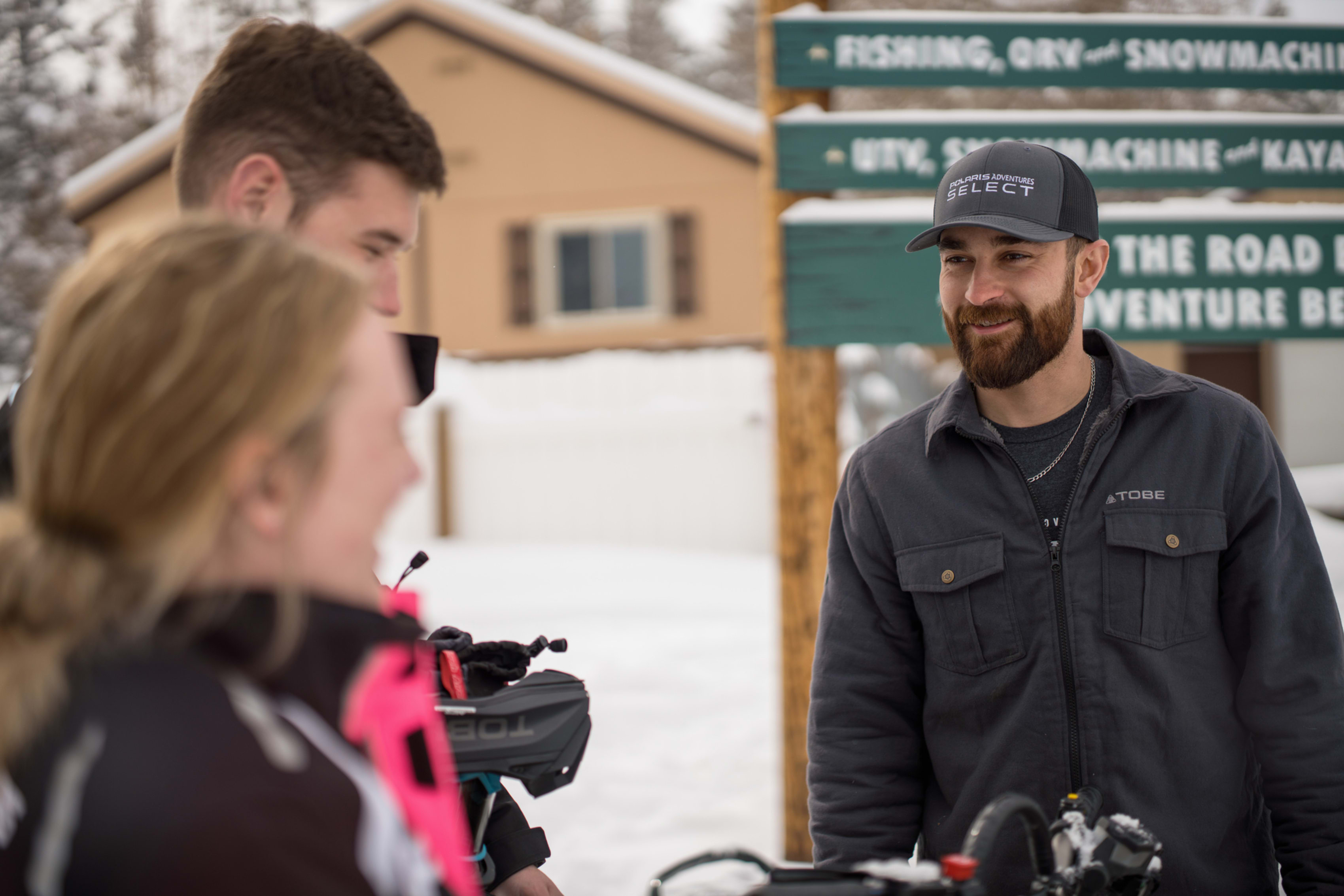 Polaris Adventures Outfitter guide talking to riders