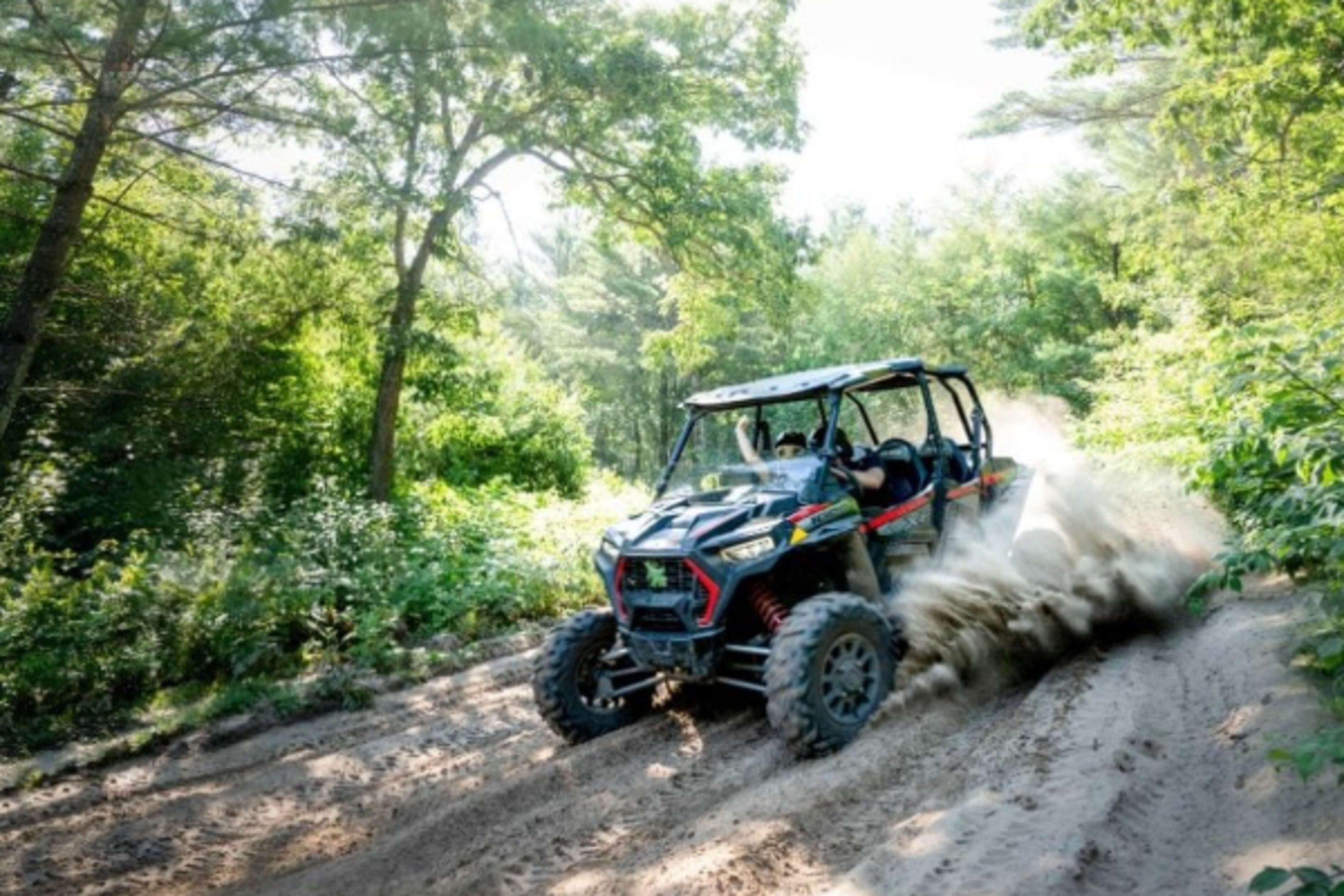 Polaris RZR kicking up dirt on Wisconsin trail