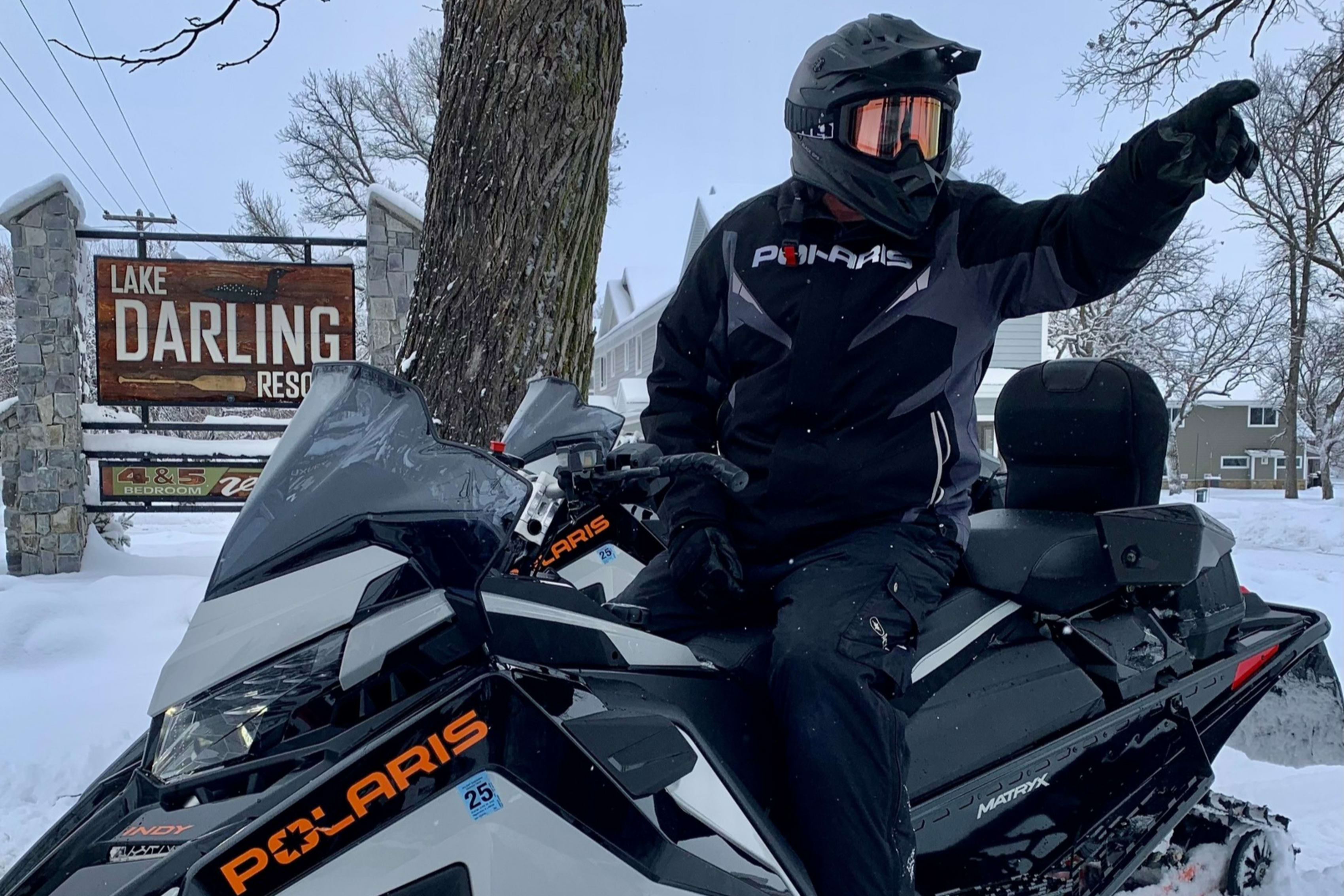 Snowmobiler on Polaris snowmobile at Lake Darling Resort