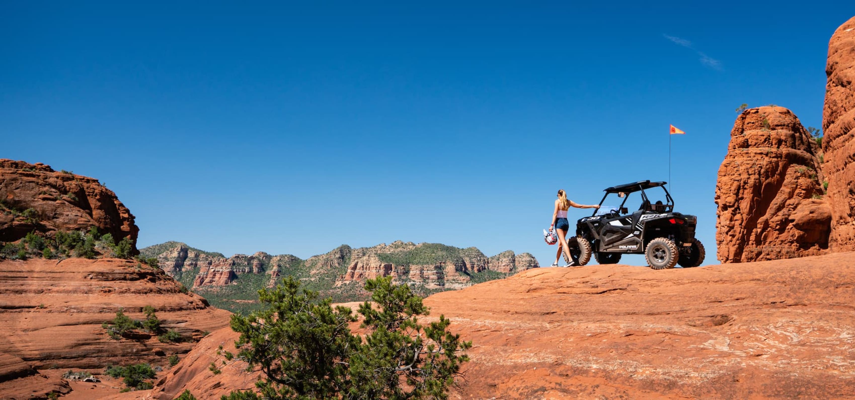 Woman by Polaris RZR in Sedona