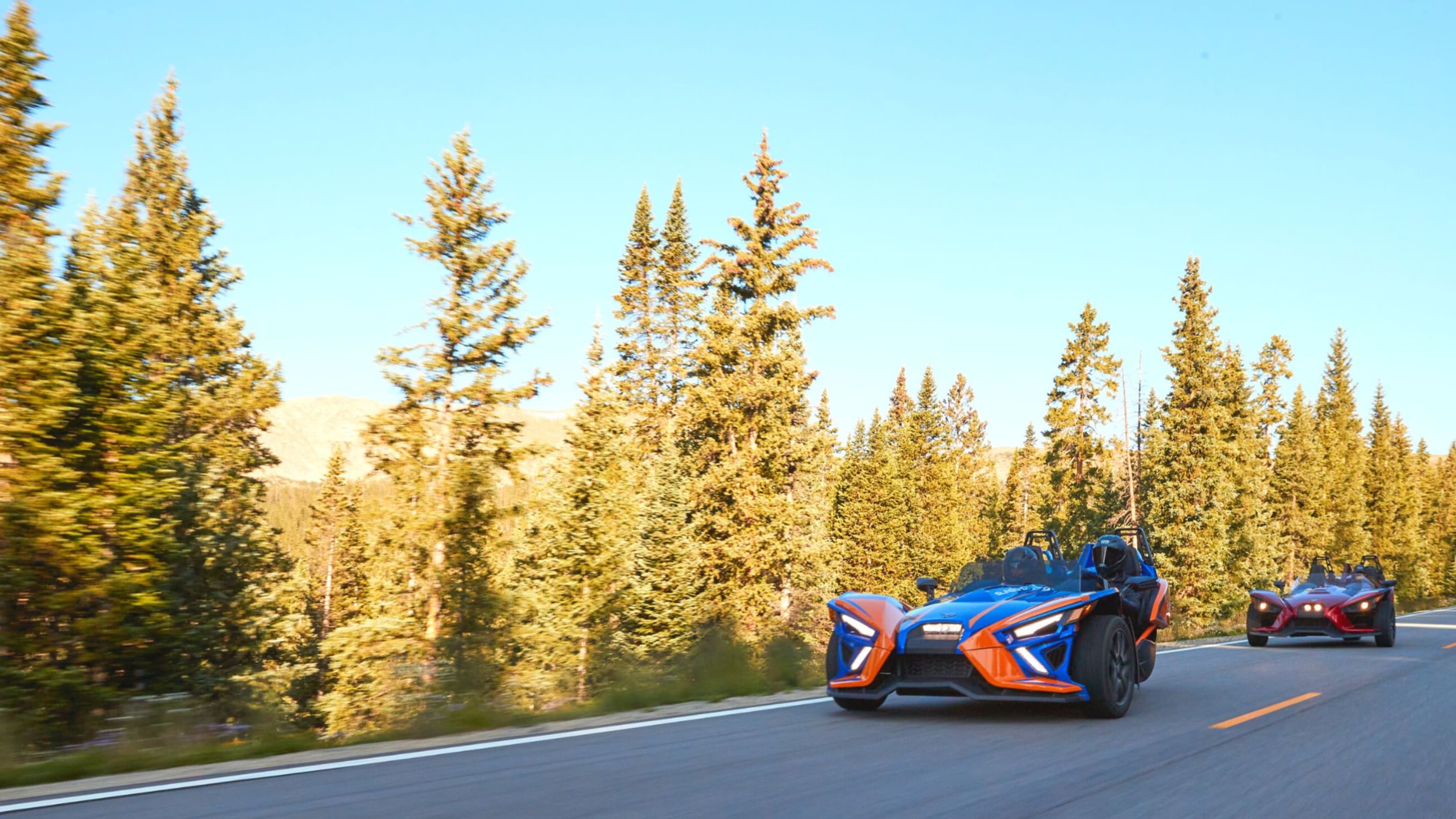 Sunset with two Polaris Slingshots