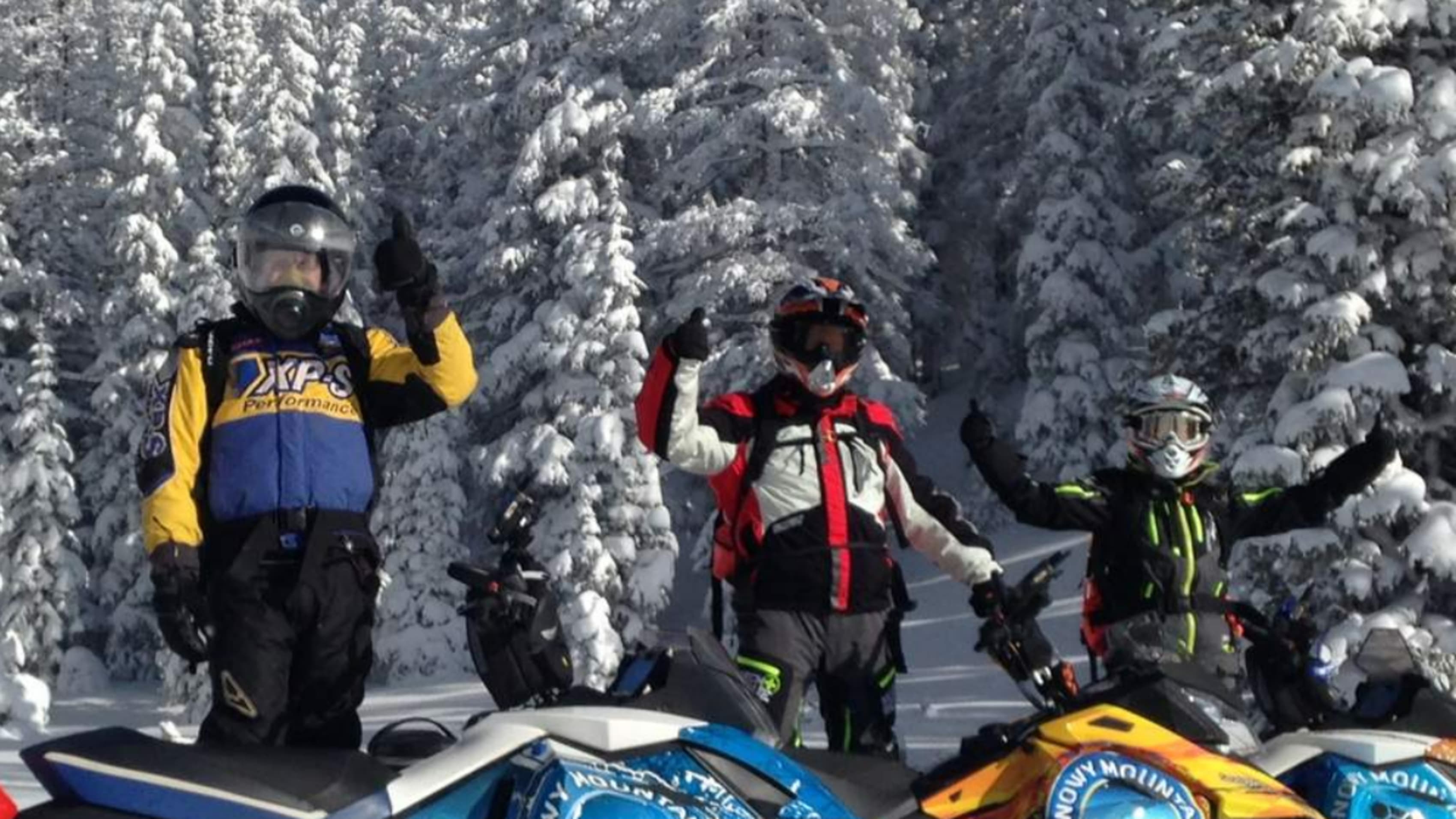 Three snowmobilers in Wyoming.