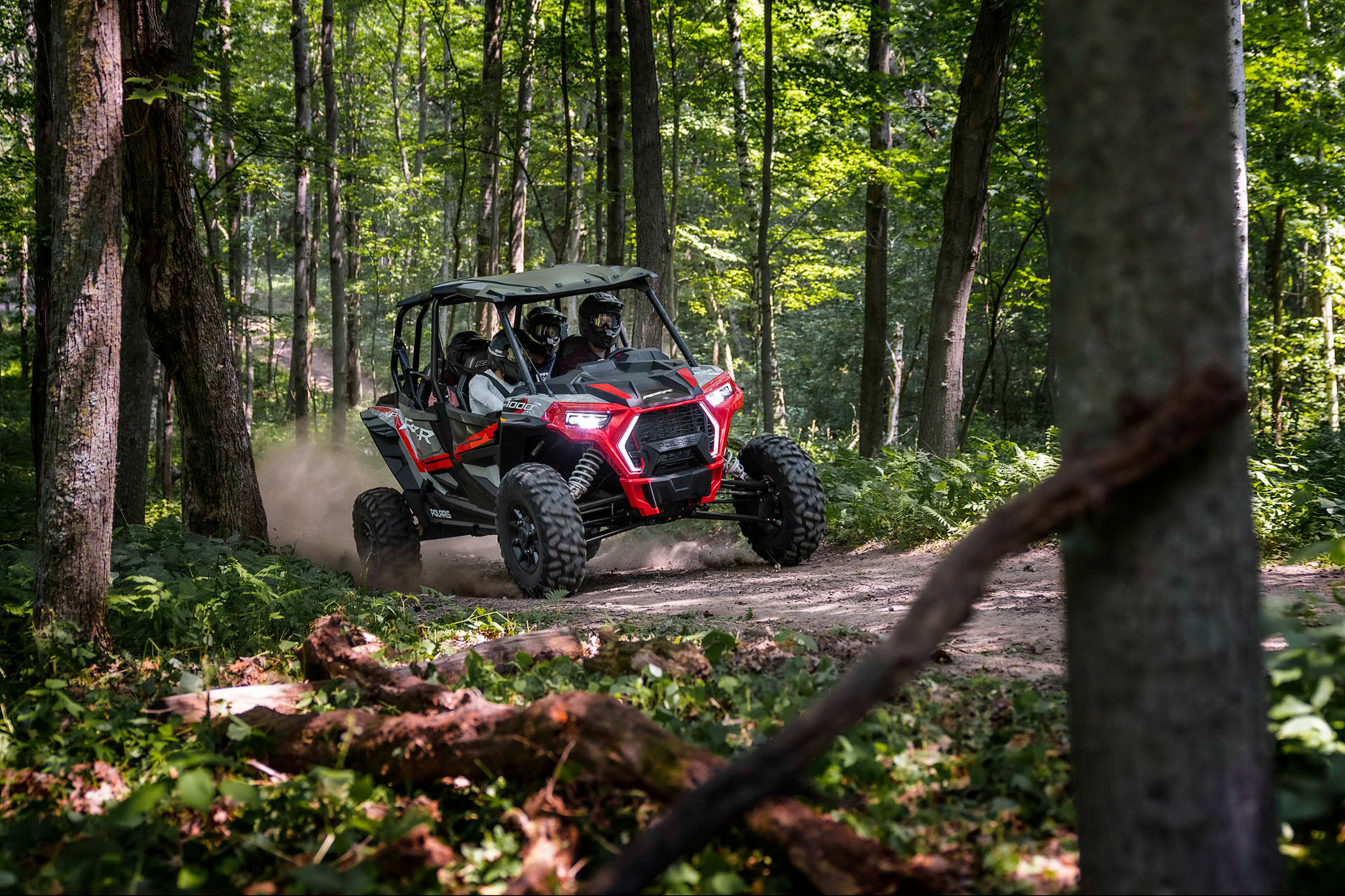 Red Polaris RZR in Upper Peninsula woods