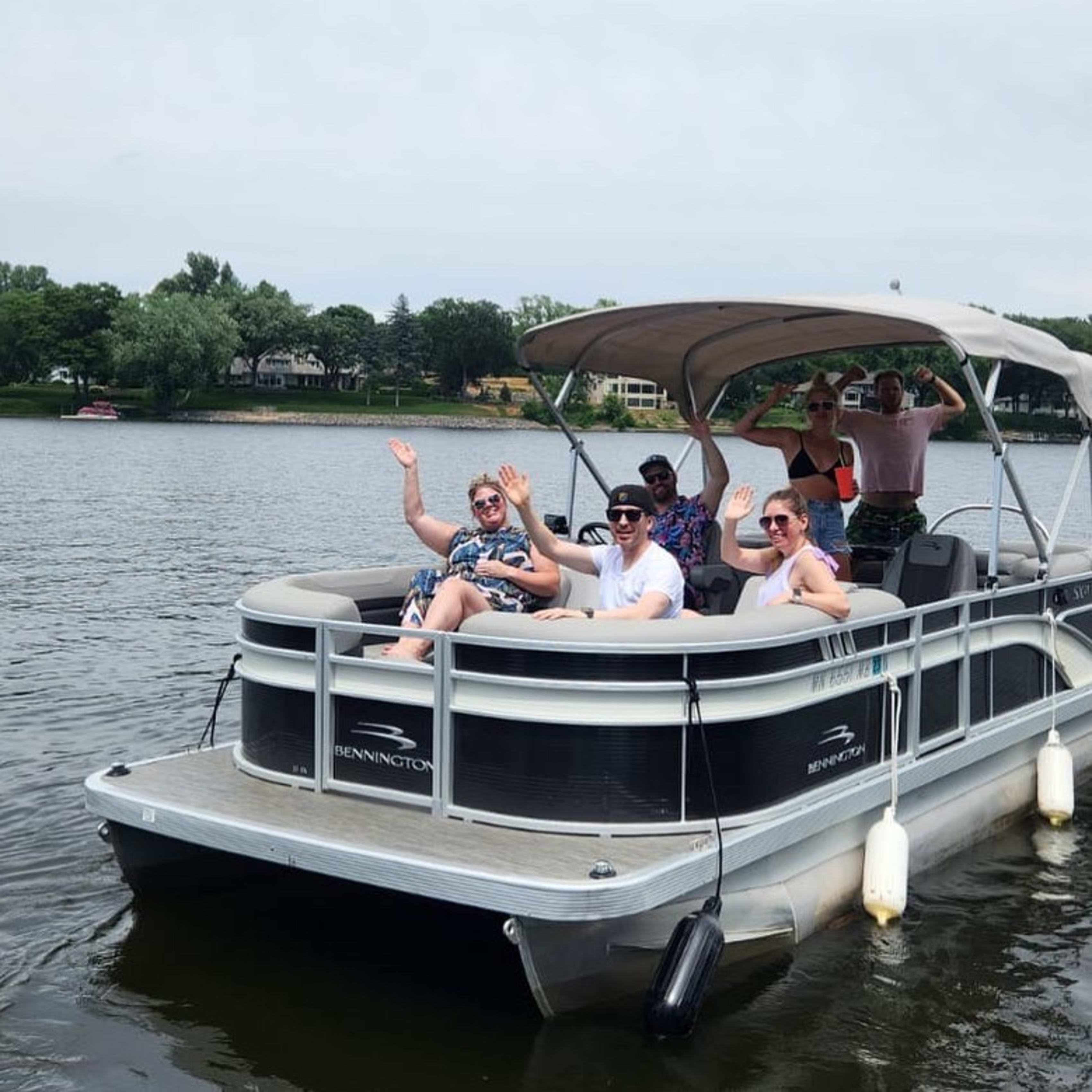Group of friends on pontoon in Minnesota
